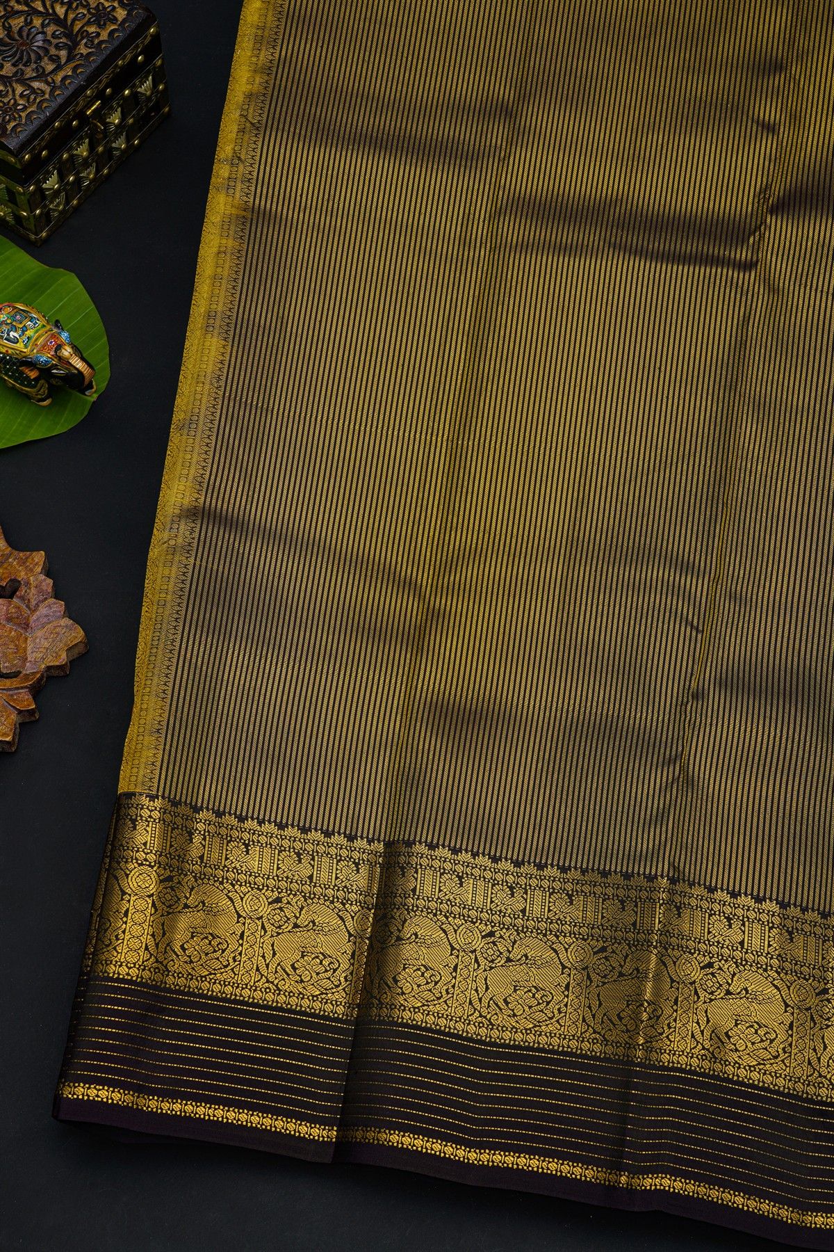 Kancheepuram Silk Yellow Saree With Florals And Leaves In Zari Body Contrast Border