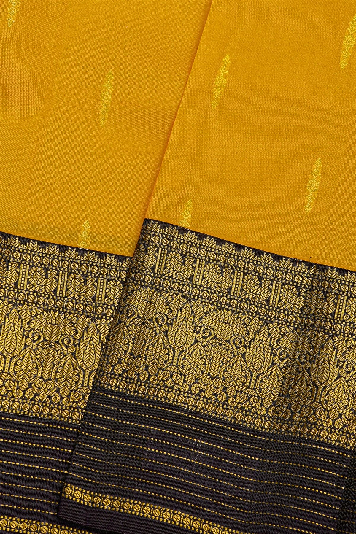 Kancheepuram Silk Yellow Saree With Florals And Leaves In Zari Body Contrast Border