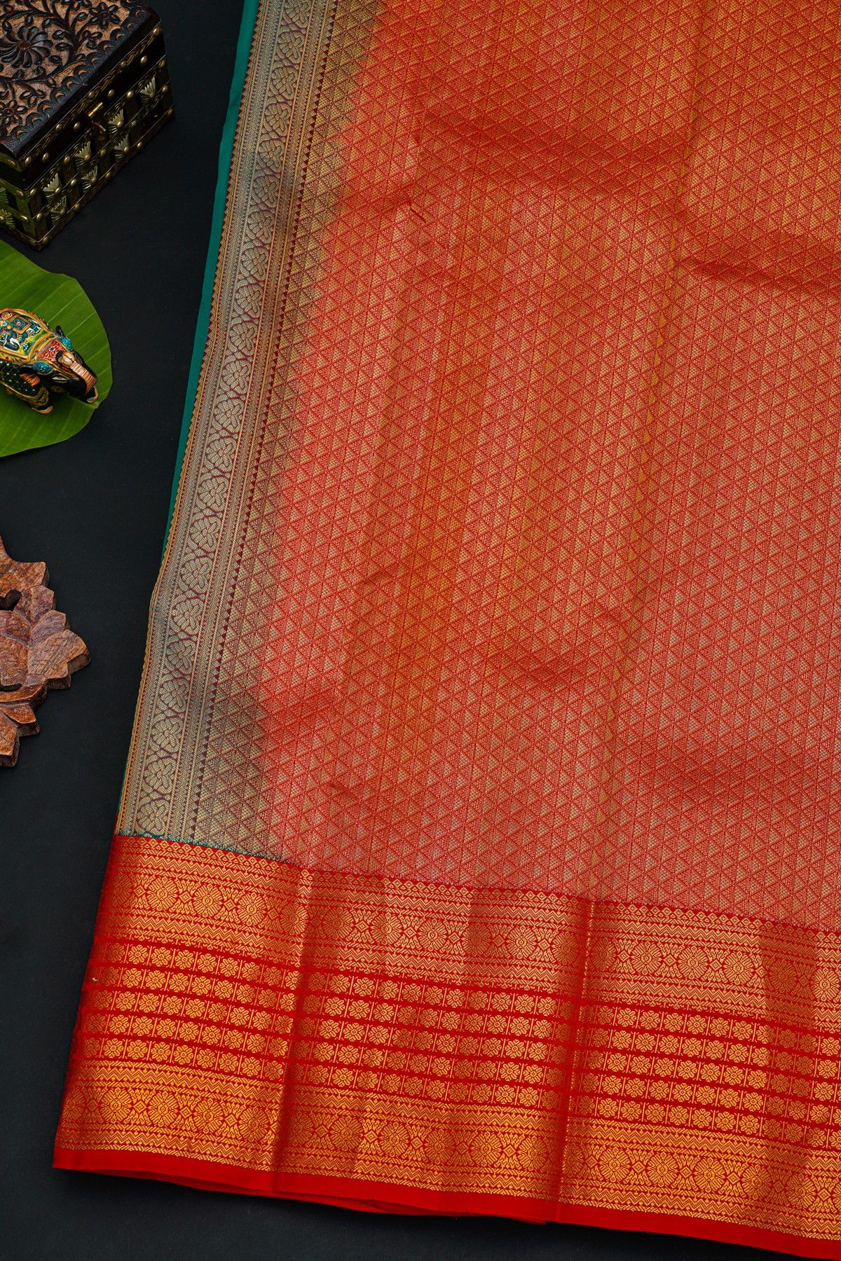 Kancheepuram Silk Peacock Green Saree With Florals And Leaves In Zari Body Red Border