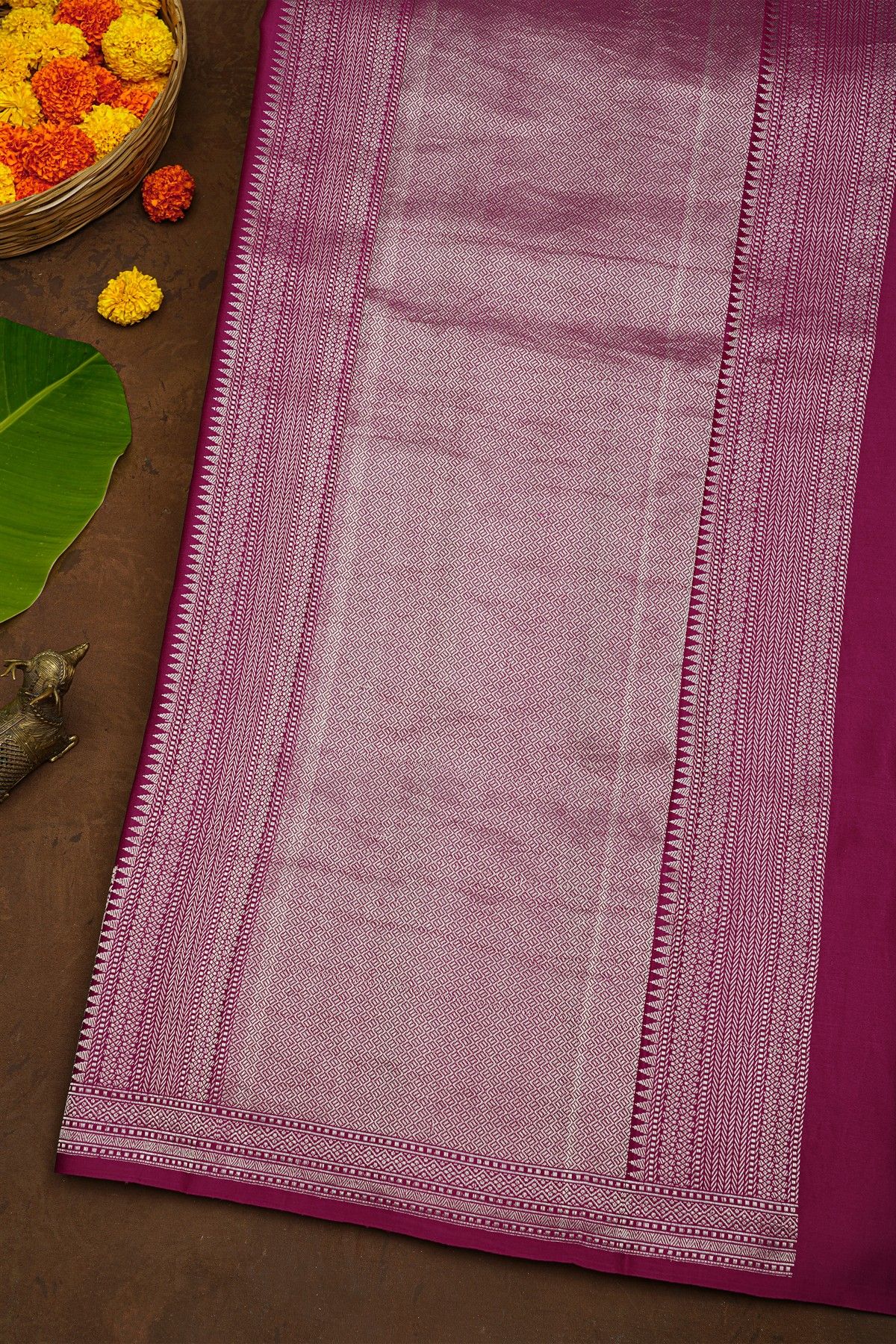 Banarasi Silk Rani Pink Saree With Florals And Leaves Body And Self Florals And Leaves Border