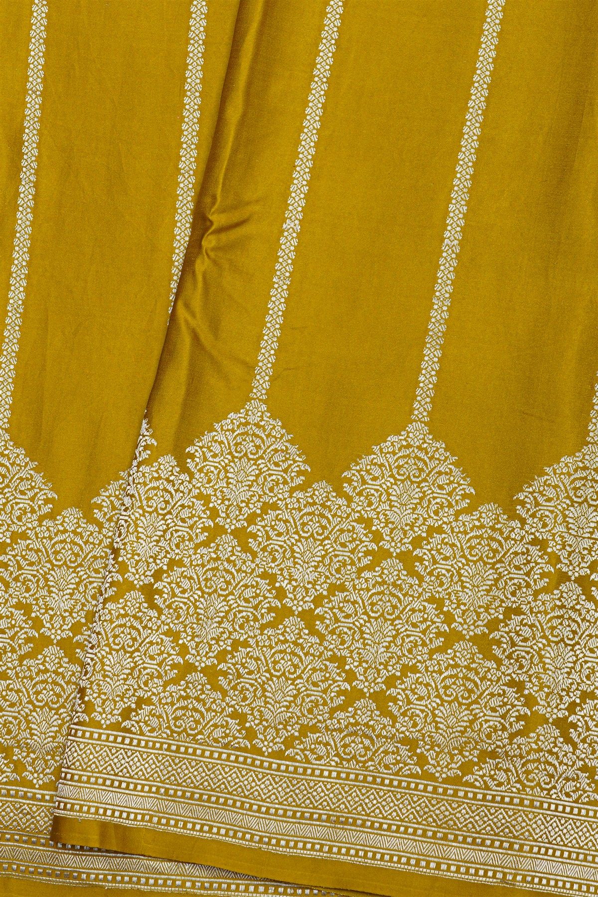 Banarasi Silk Mustard Saree With Zari Lines Body And Self Florals And Leaves Border