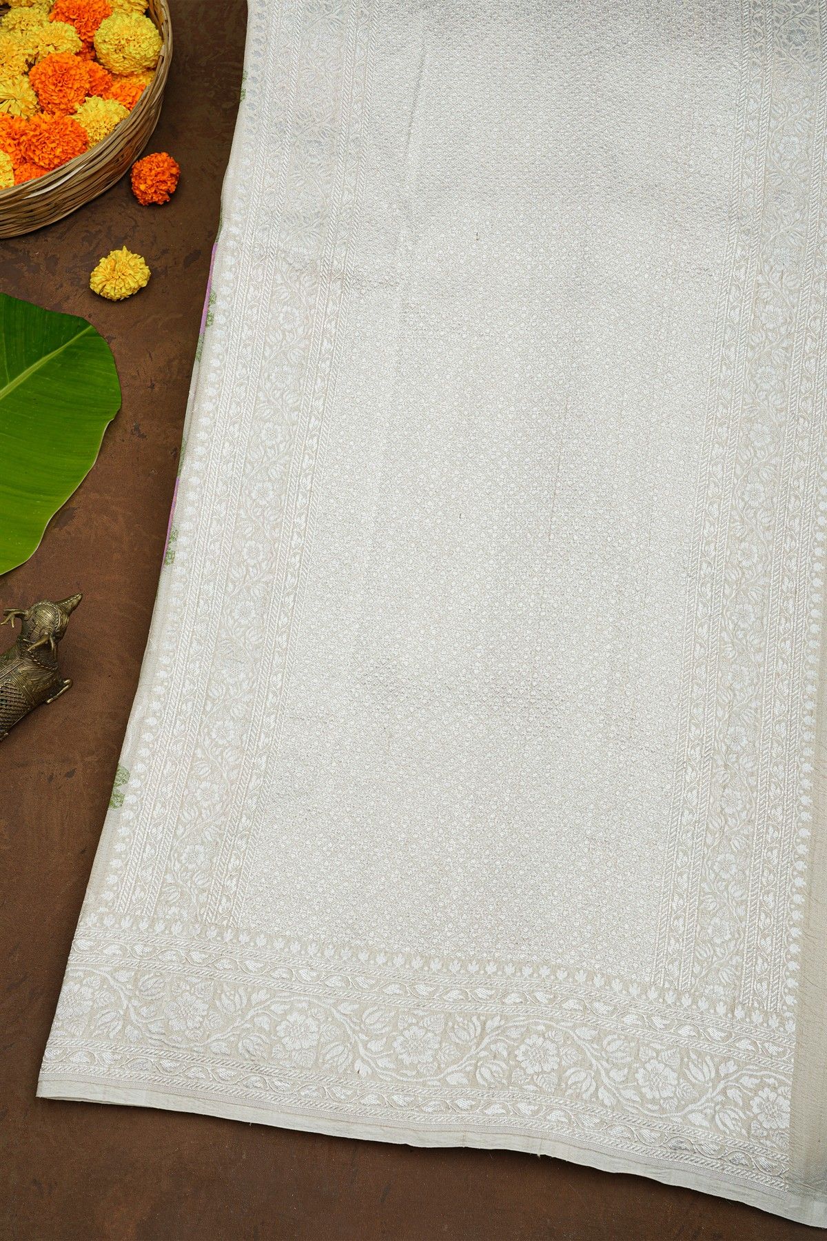 Banarasi Silk Off White Saree With Florals And Leaves Body And Self Florals And Leaves Jaal Border