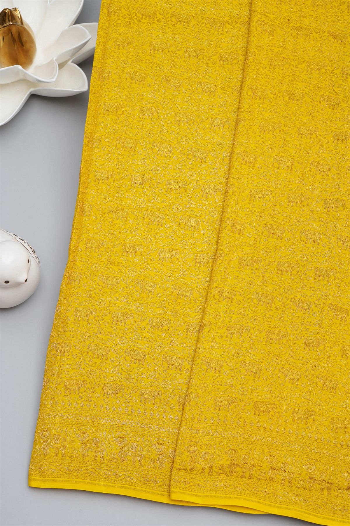 Banarasi Kaddi Georgette Yellow Saree With Florals And Elephants In Zari Border