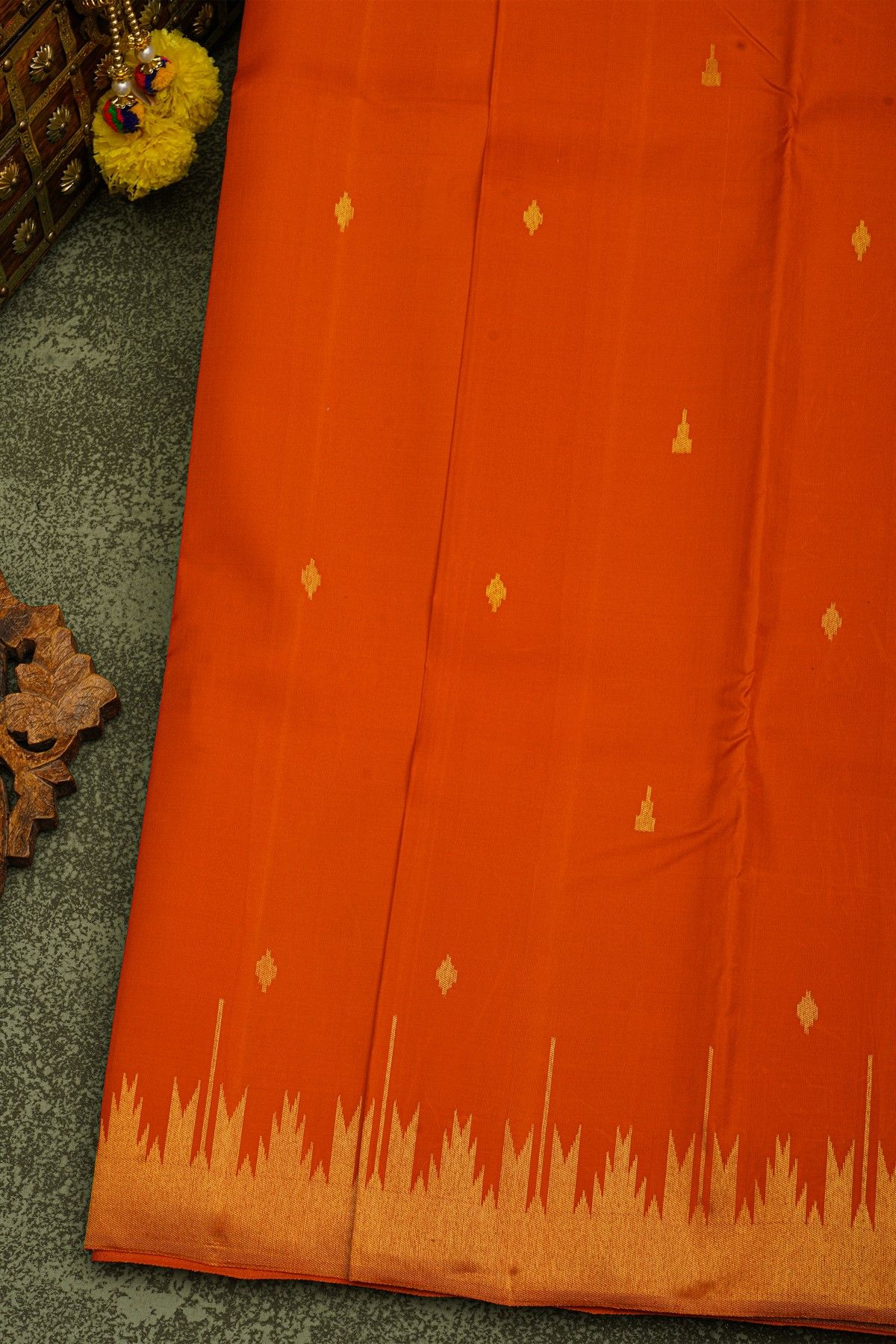 Kancheepuram Silk Rust Saree With Floral Buttis Body And Self Temple Border And Kaddi Pallu