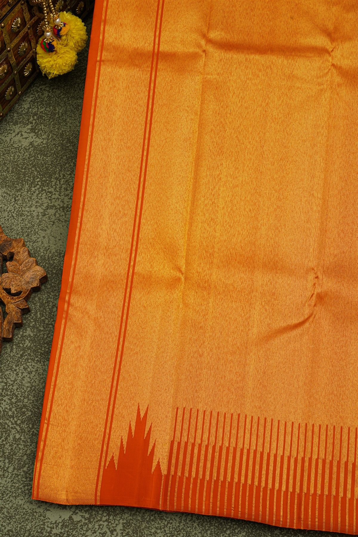 Kancheepuram Silk Rust Saree With Floral Buttis Body And Self Temple Border And Kaddi Pallu