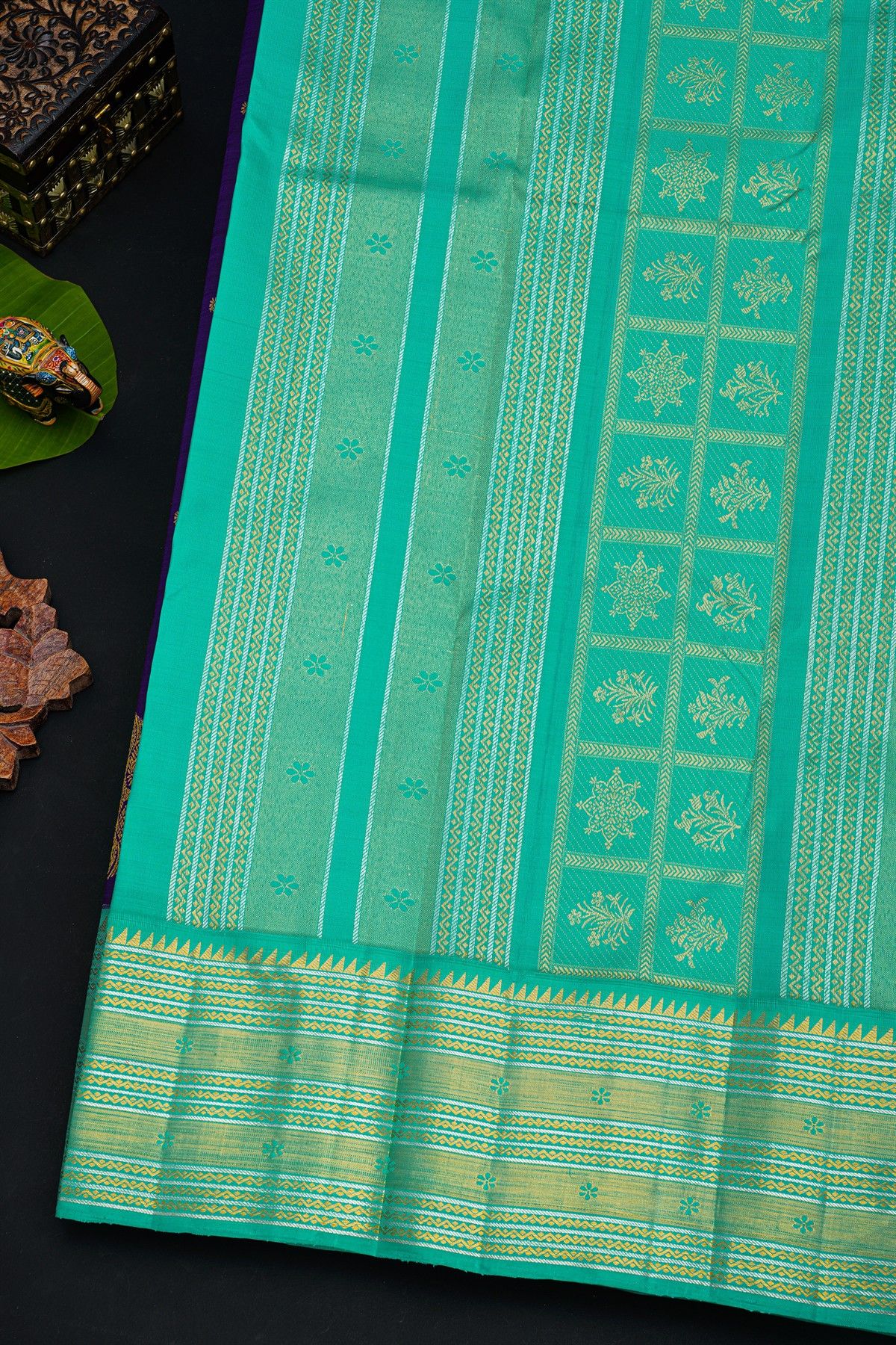 Kancheepuram Silk Royal Blue Saree With Florals And Buttis Body And Contrast Zig-Zag Lines And Florals Border