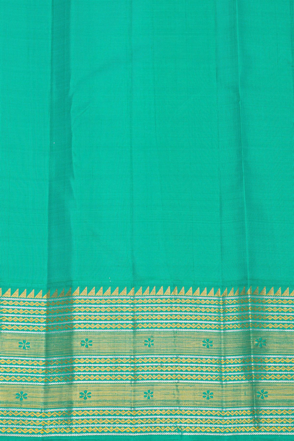 Kancheepuram Silk Royal Blue Saree With Florals And Buttis Body And Contrast Zig-Zag Lines And Florals Border