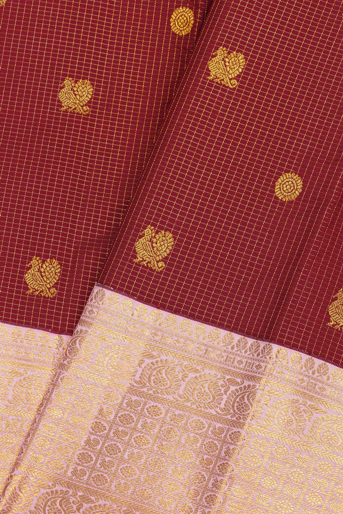 Kancheepuram Silk Maroon Saree With Florals And Peacocks In Checks Body And Contrast Florals And Peacocks Border