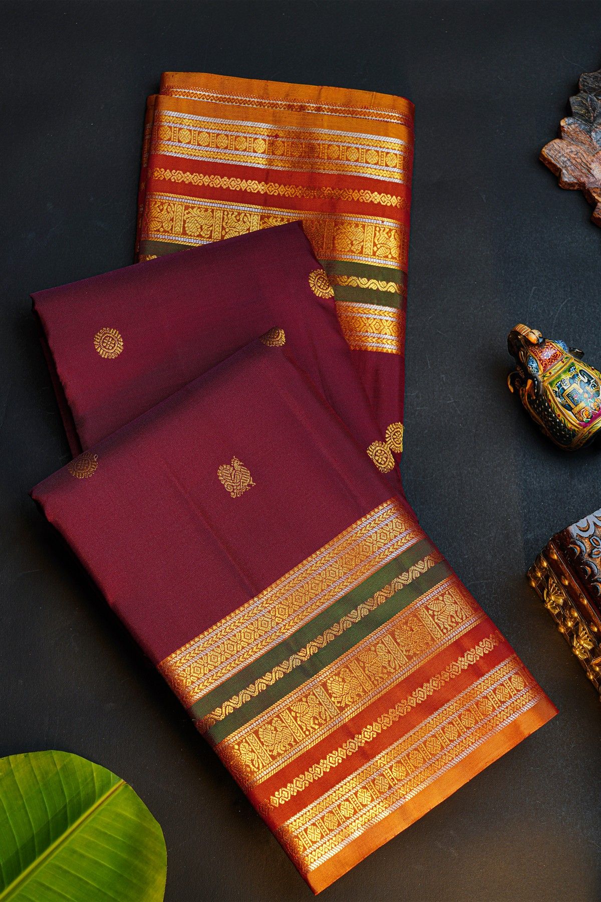 Kancheepuram Silk Wine Saree With Florals And Peacocks Body And Contrast Florals And Peacocks Border