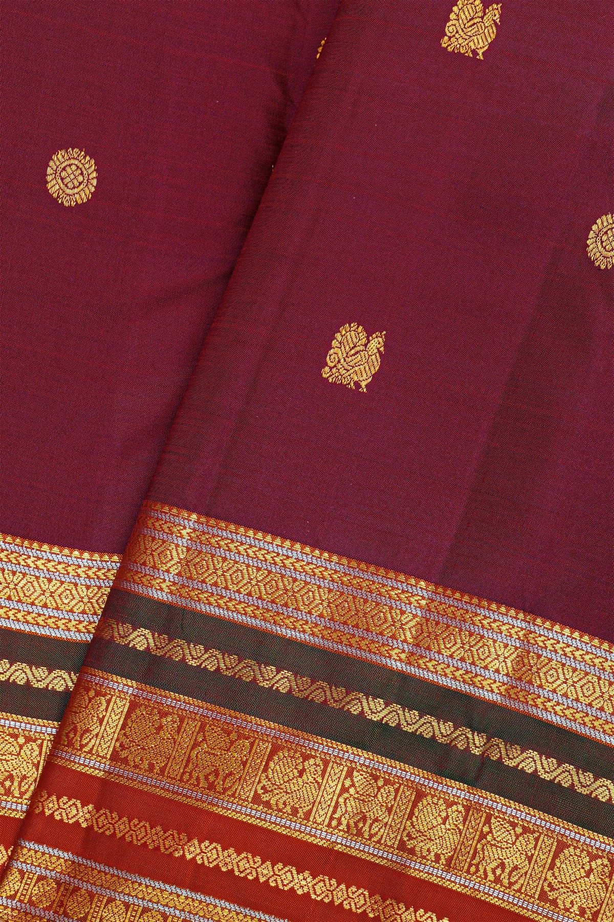 Kancheepuram Silk Wine Saree With Florals And Peacocks Body And Contrast Florals And Peacocks Border