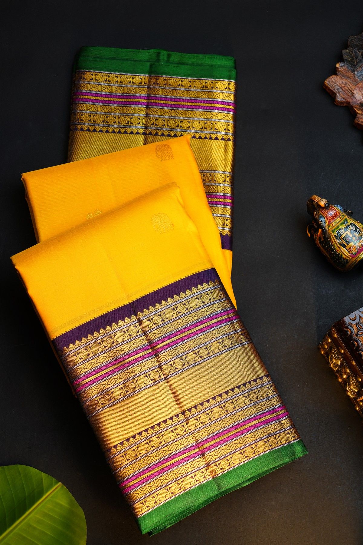 Kancheepuram Silk Yellow Saree With Gold Buttas And Peacock And Elephant Motif Kaddi Zari Border
