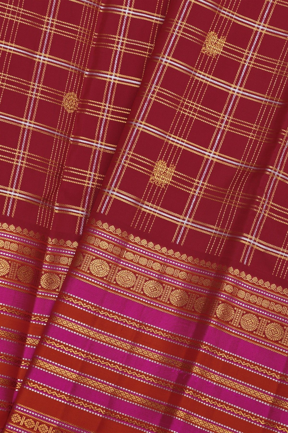 Kancheepuram Silk Maroon Saree With Florals And Peacocks In Checks Body And Self Zig-Zag Lines And Florals Border