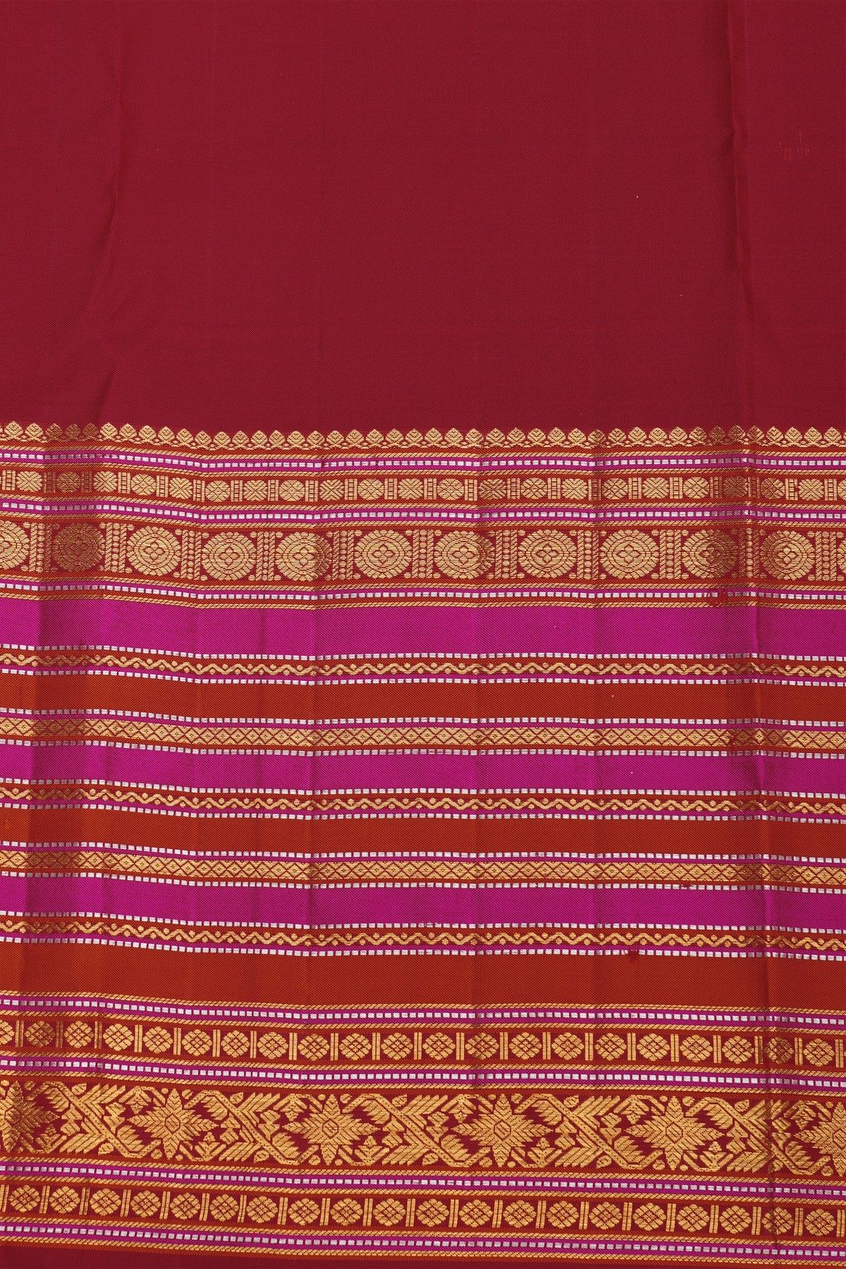 Kancheepuram Silk Maroon Saree With Florals And Peacocks In Checks Body And Self Zig-Zag Lines And Florals Border