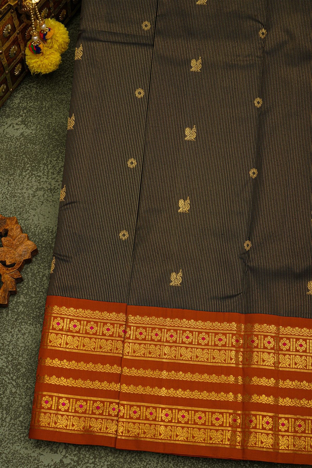 Kancheepuram Silk Black Saree With Gold Buttas And Rich Orange Traditional Zari Border