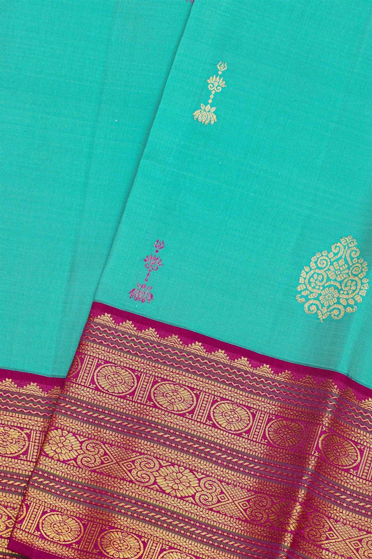 Kancheepuram Silk Sky Blue Saree With Florals And Buttis Body And Contrast Florals And Buttis Border