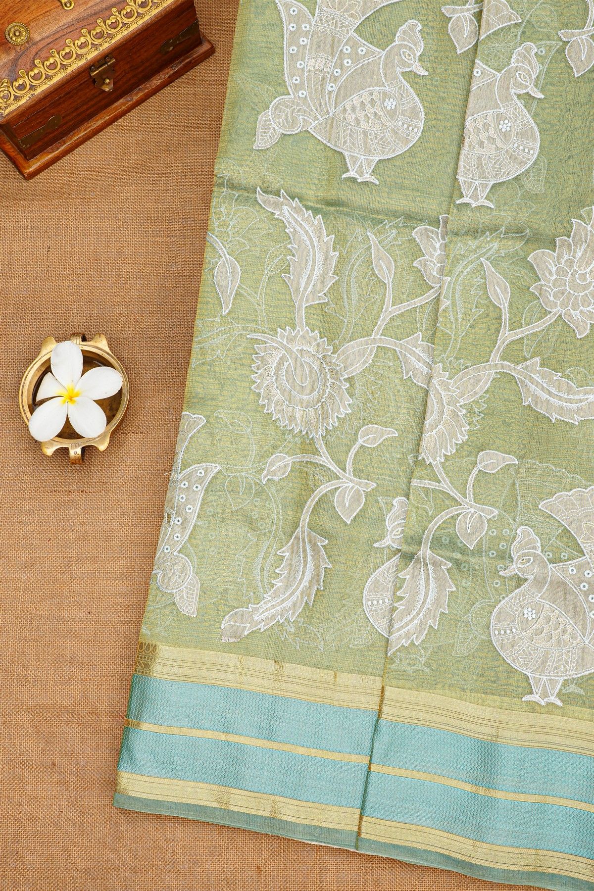 Fancy Kora Sage Green Saree With Florals And Peacocks In Thread Work Body And Contrast Zig-Zag Lines Border And Zari Lines Pallu