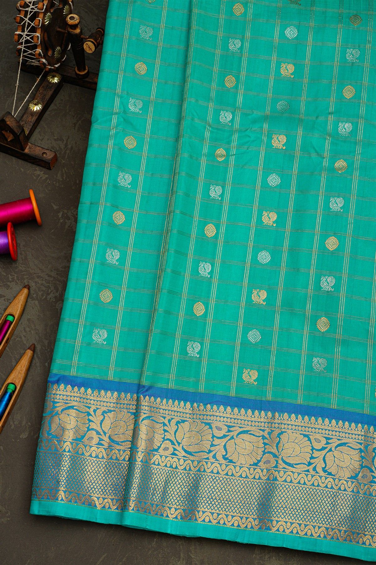 Gadwal Silk Sea Blue Saree With Florals And Peacocks In Zari Checks Body