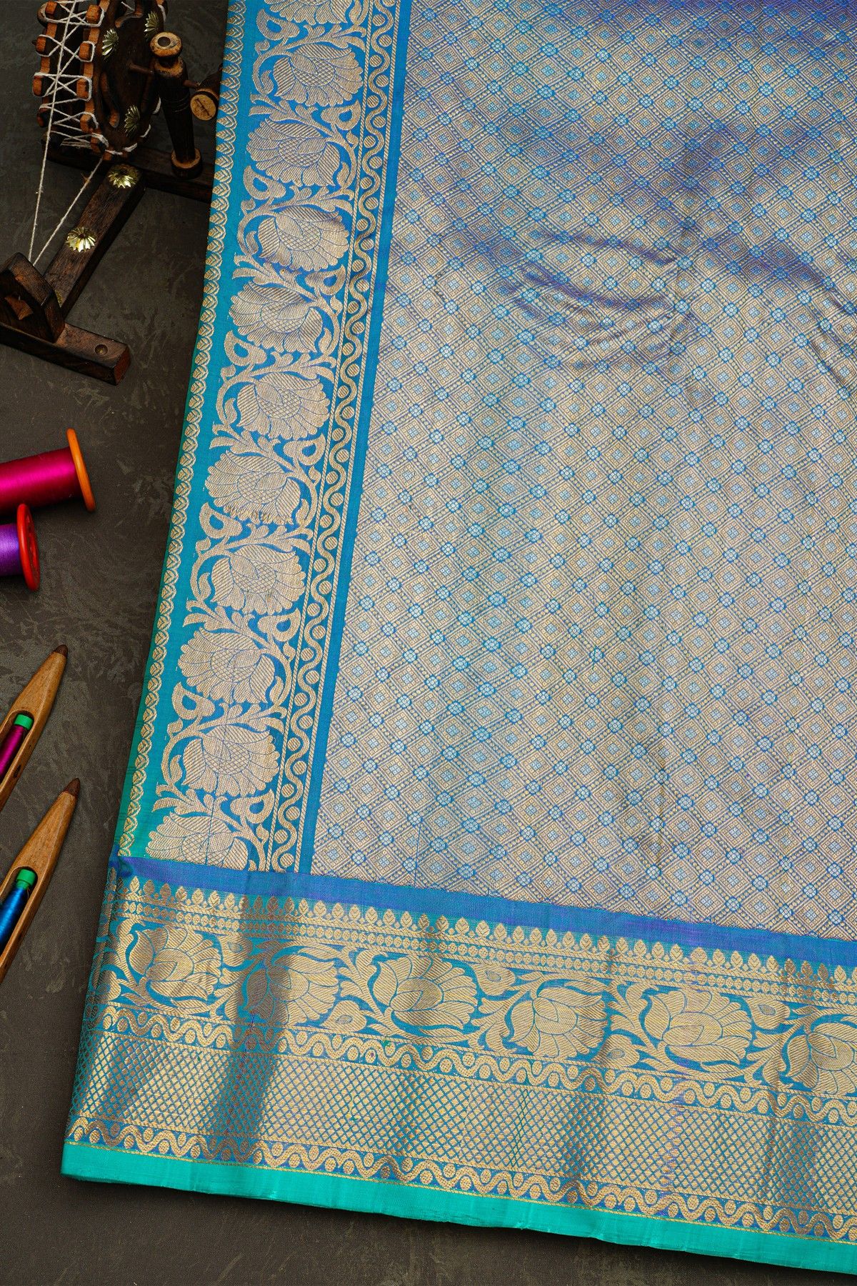 Gadwal Silk Sea Blue Saree With Florals And Peacocks In Zari Checks Body