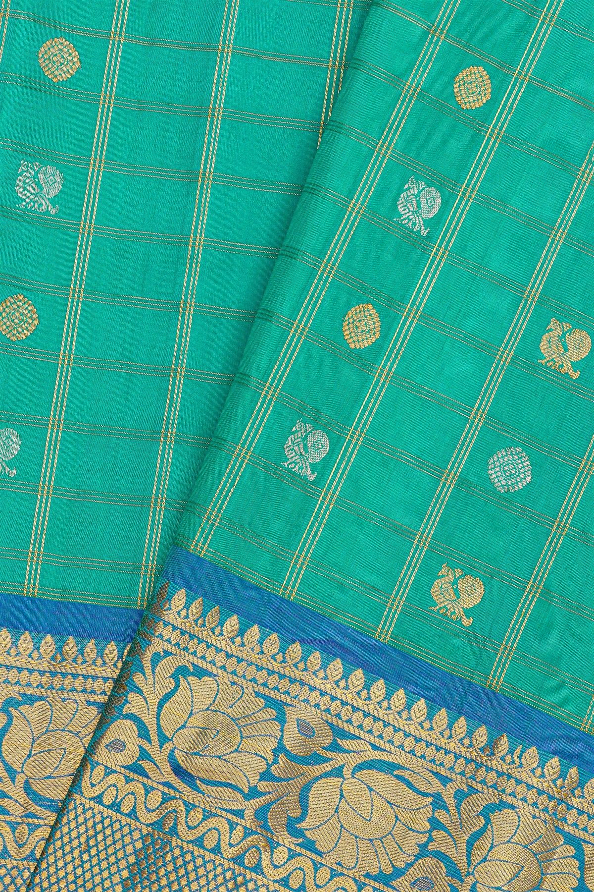 Gadwal Silk Sea Blue Saree With Florals And Peacocks In Zari Checks Body