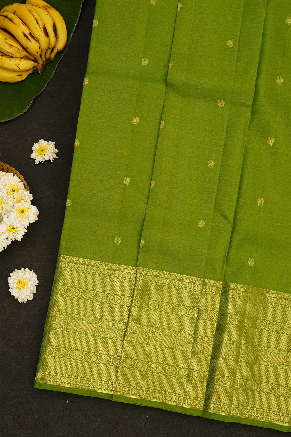 Kancheepuram Silk Parrot Green Saree With Peacock Buttis Body