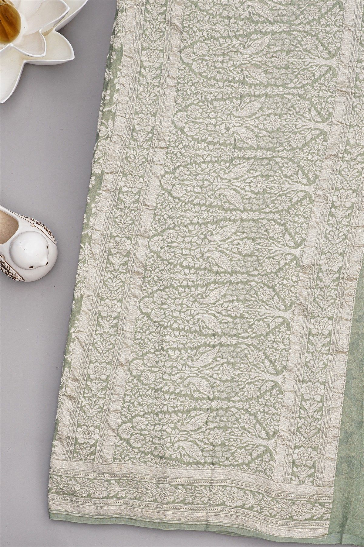 Banarasi Georgette Light Green Saree WIth Florals And Leaves Border