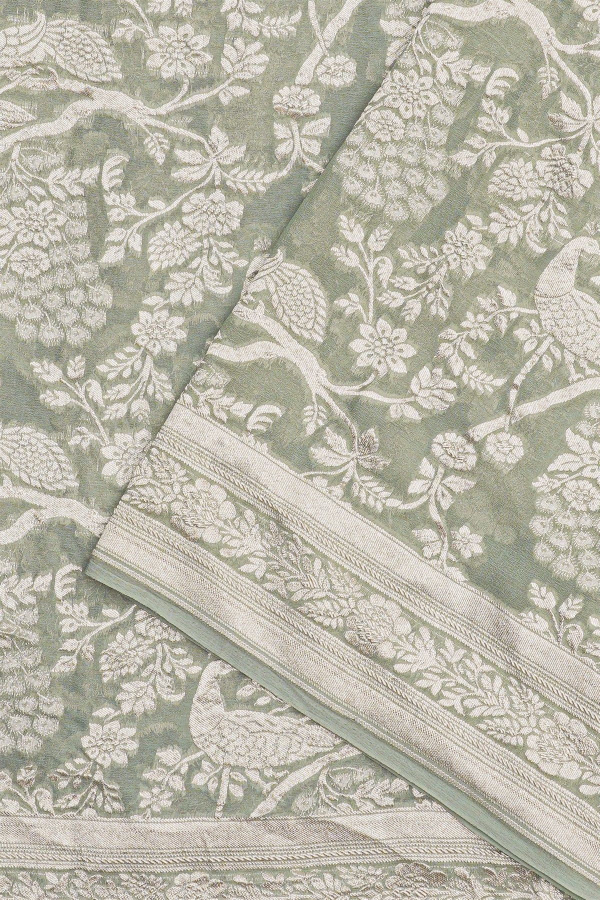 Banarasi Georgette Light Green Saree WIth Florals And Leaves Border