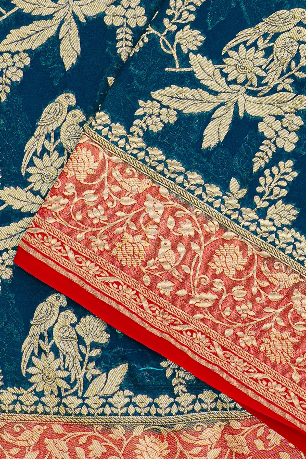 Banarasi Kaddi Georgette Teal Blue Saree With Florals And Parrots Body