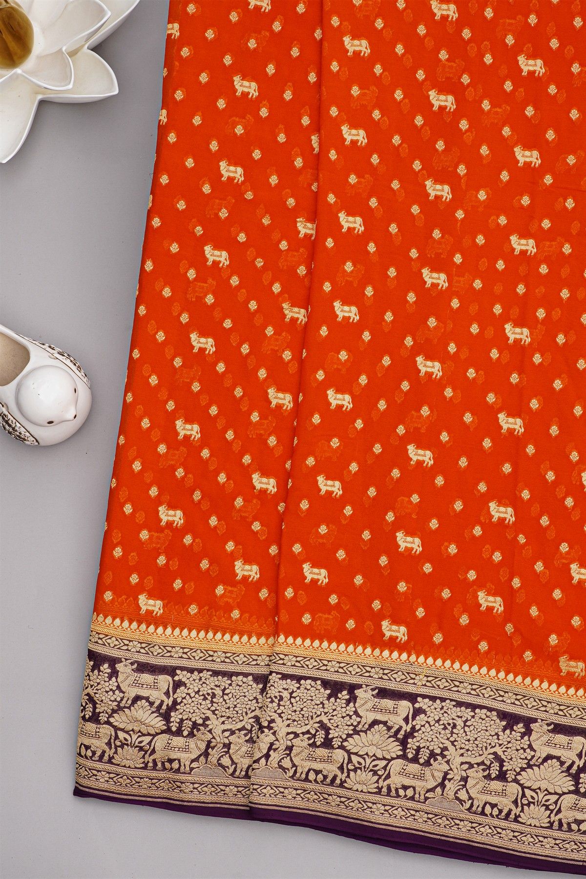 Banarasi Georgette Rust Orange Saree With Florals And Small Cow Buttis Body