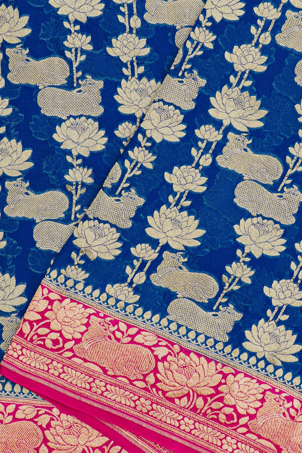 Banarasi Georgette Royal Blue Saree With Florals And Leaves With Cows Body