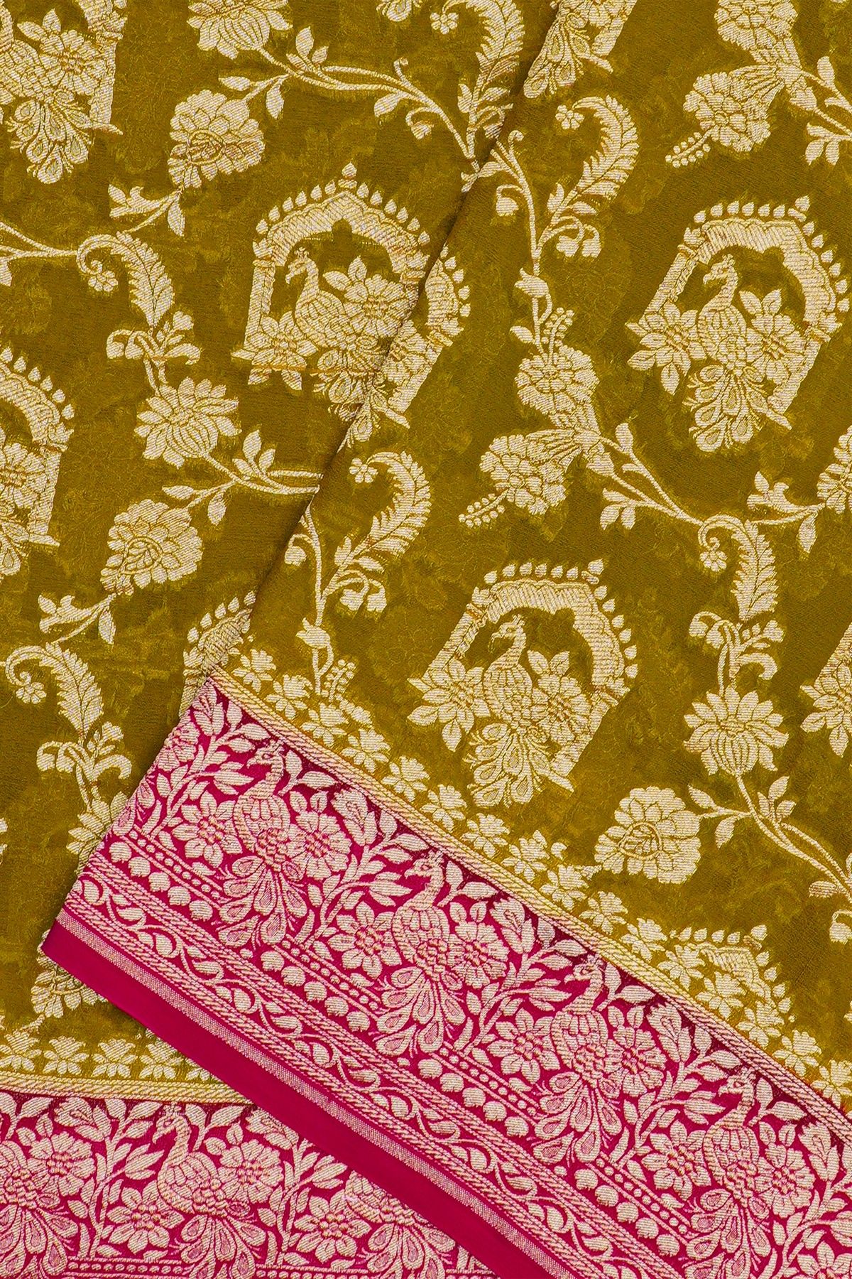 Banarasi Georgette Mehendi Green Saree With Florals And Leaves With Peacocks Body