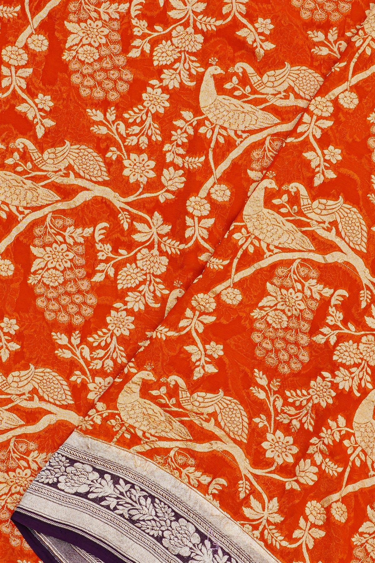 Banarasi Georgette Orange Saree With Florals And Leaves Border