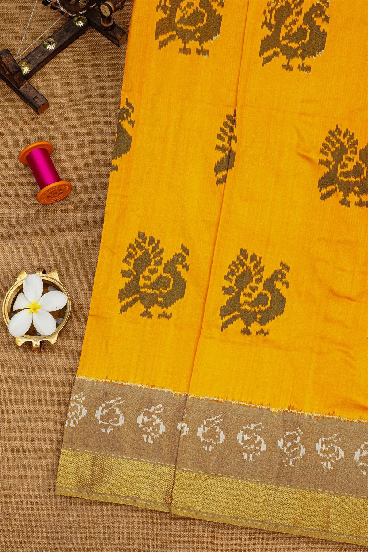 Ikat Silk Yellow Saree With Peacock Buttis Body