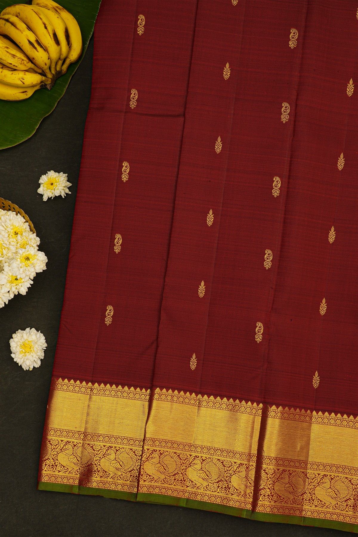 Kancheepuram Silk Maroon Saree With Cross Lines In Zari With Peacocks Border