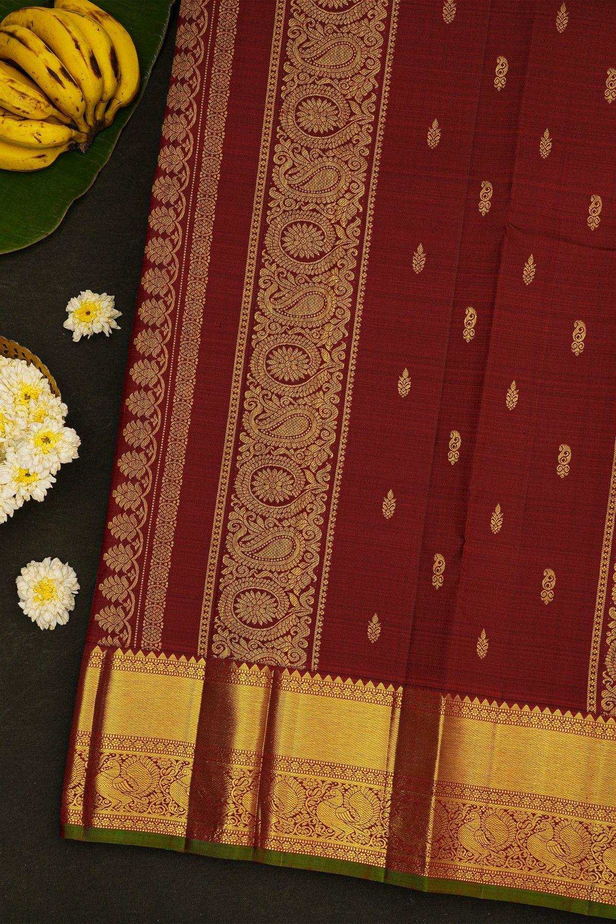 Kancheepuram Silk Maroon Saree With Cross Lines In Zari With Peacocks Border