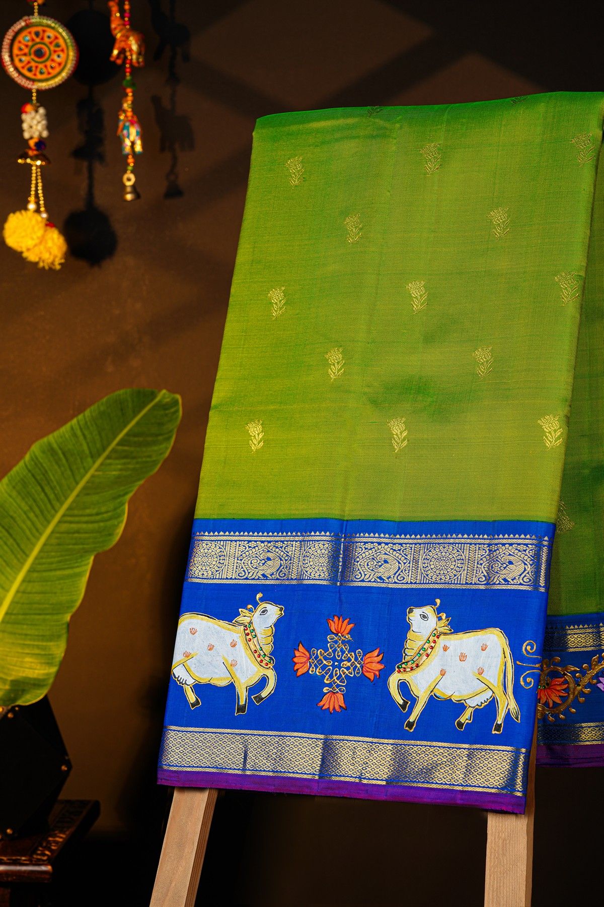 Gadwal Silk Green Saree With Tanjore Hand Painted Florals And Pichwai Cows Border