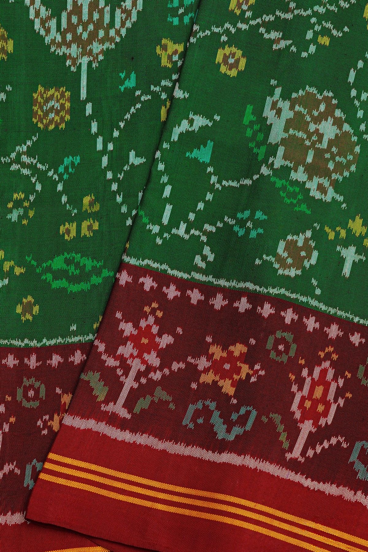 Patola Silk Green Saree With All Over Jaals And Leaf Lines Border