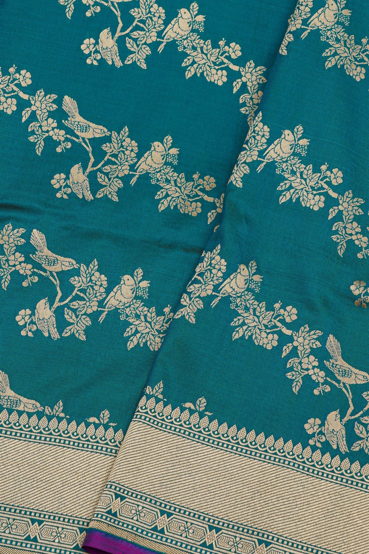 Banarasi Silk Peacock Blue Saree With Cross Lines In Zari Border