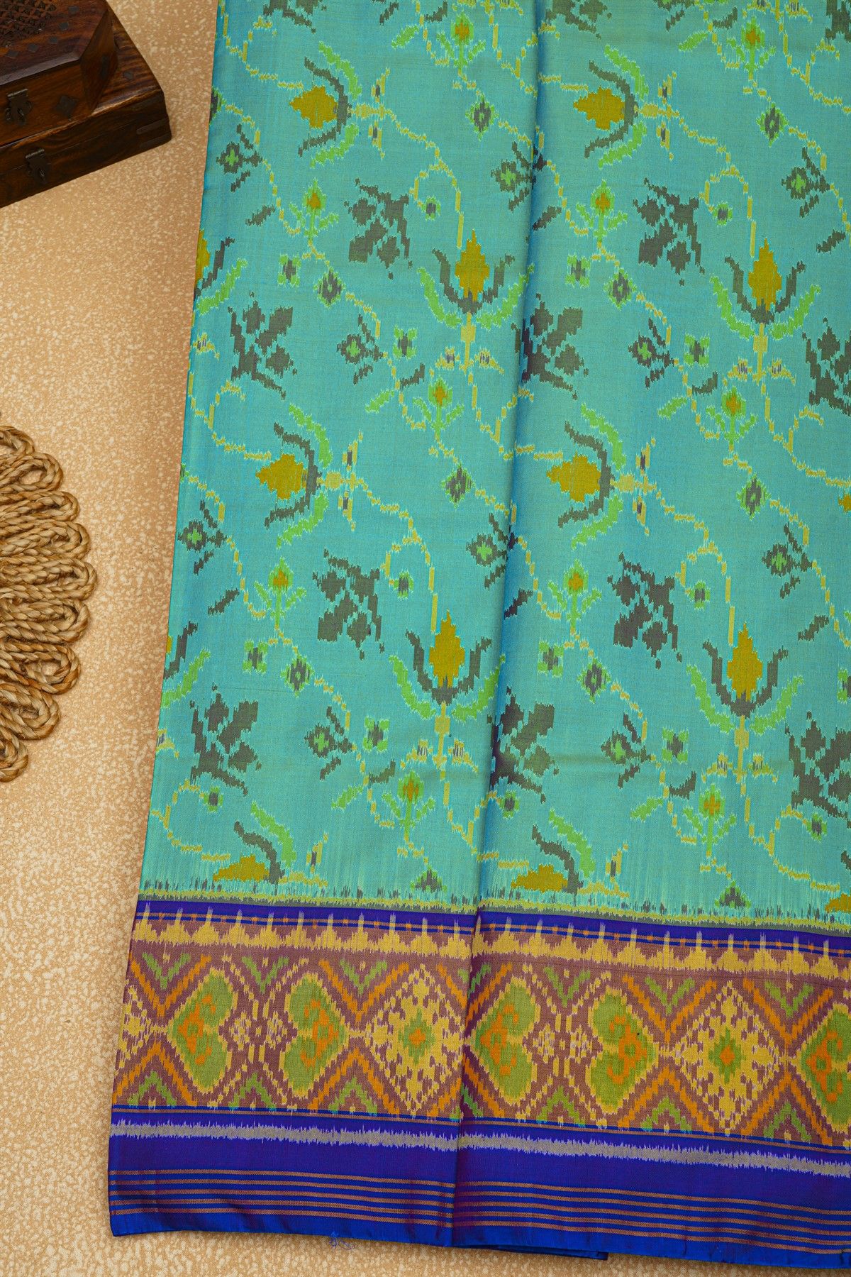 Patola Silk Sea Green Saree With Florals And Leaves Jaal Border