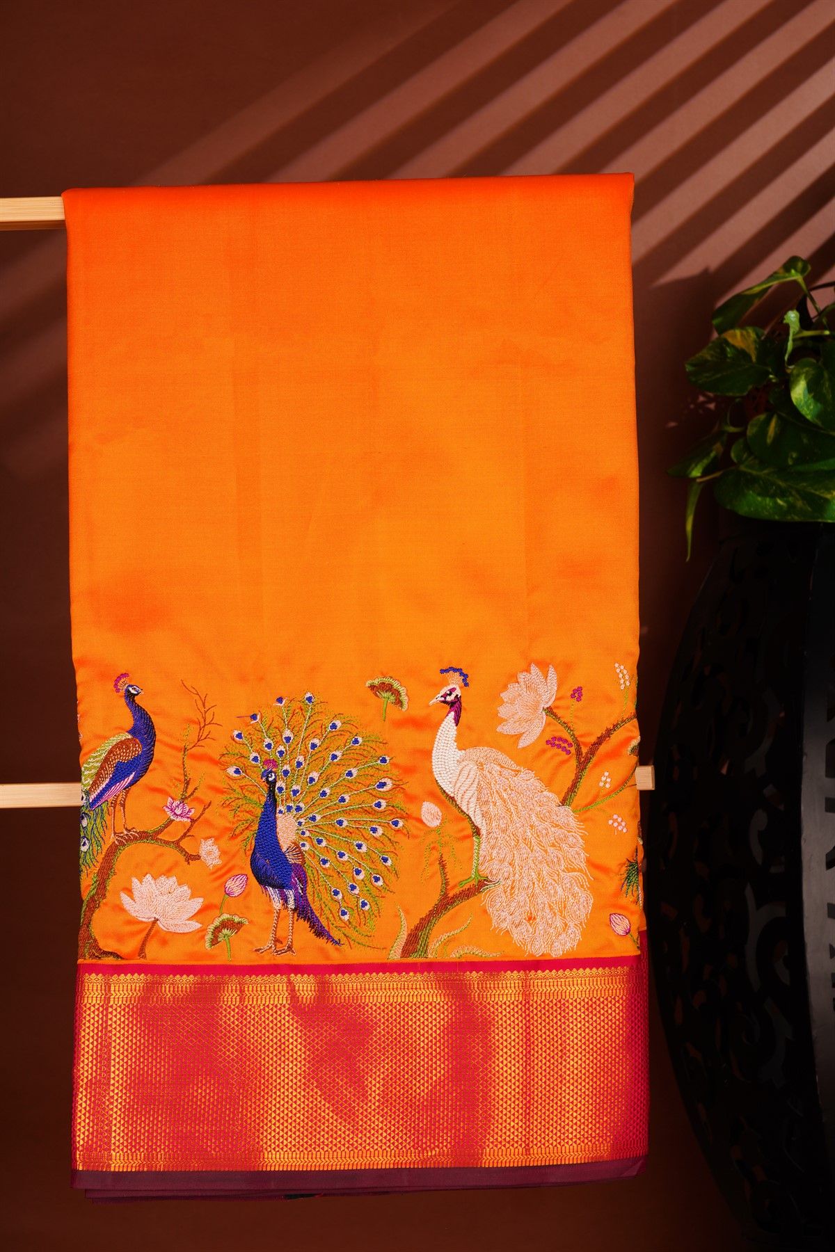 Kancheepuram Silk Orange Saree With Floral And Peacock Thread Work And Zari Border