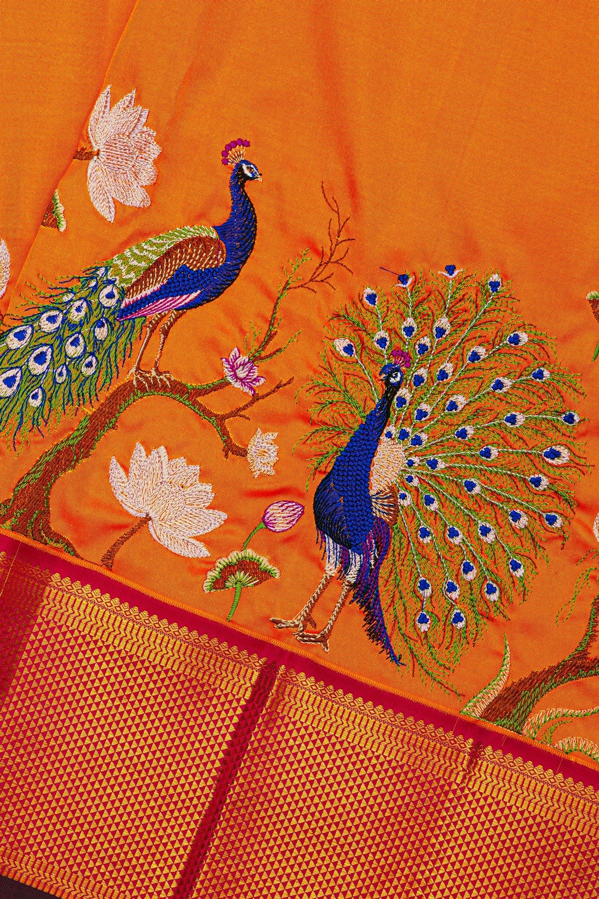 Kancheepuram Silk Orange Saree With Floral And Peacock Thread Work And Zari Border