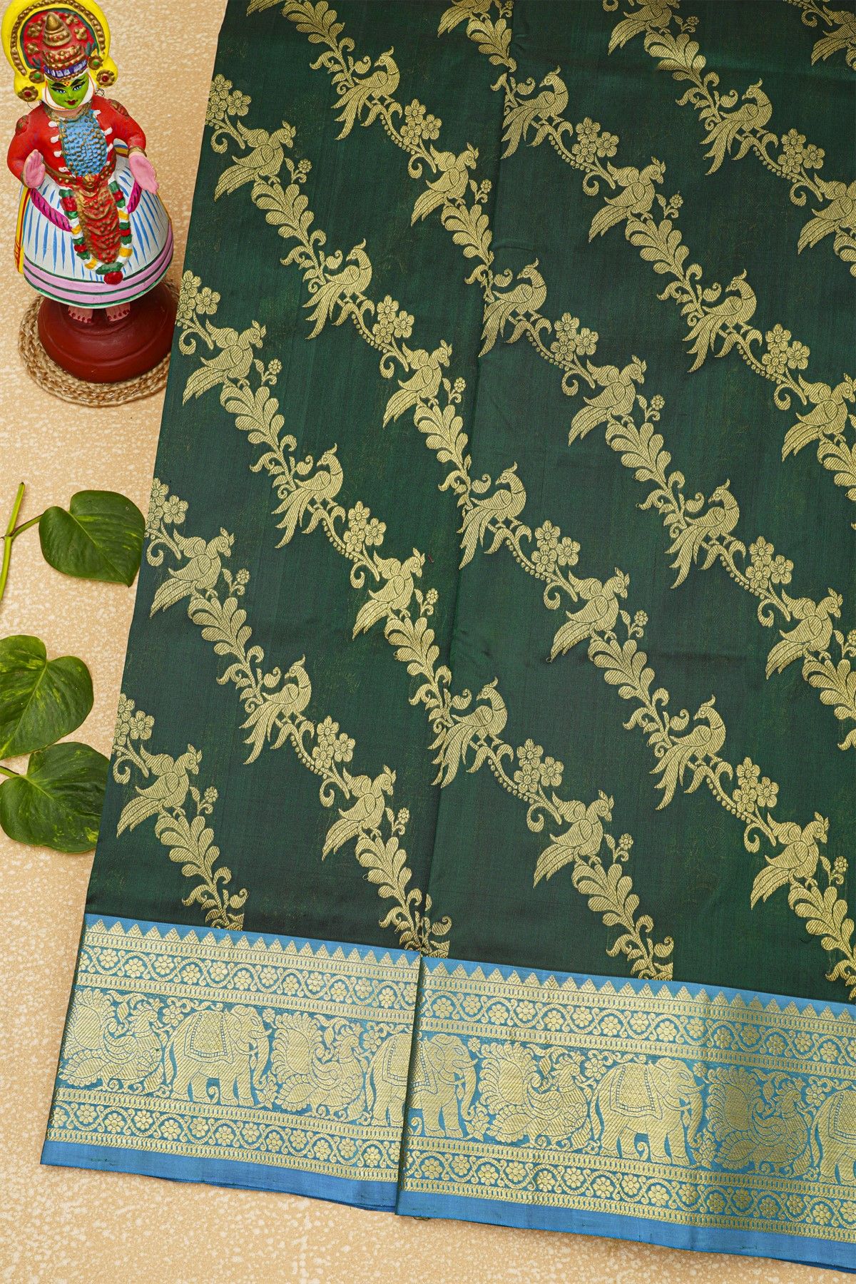 Venkatagiri Silk Bottle Green Saree With Floral Jaal And Peacocks Body