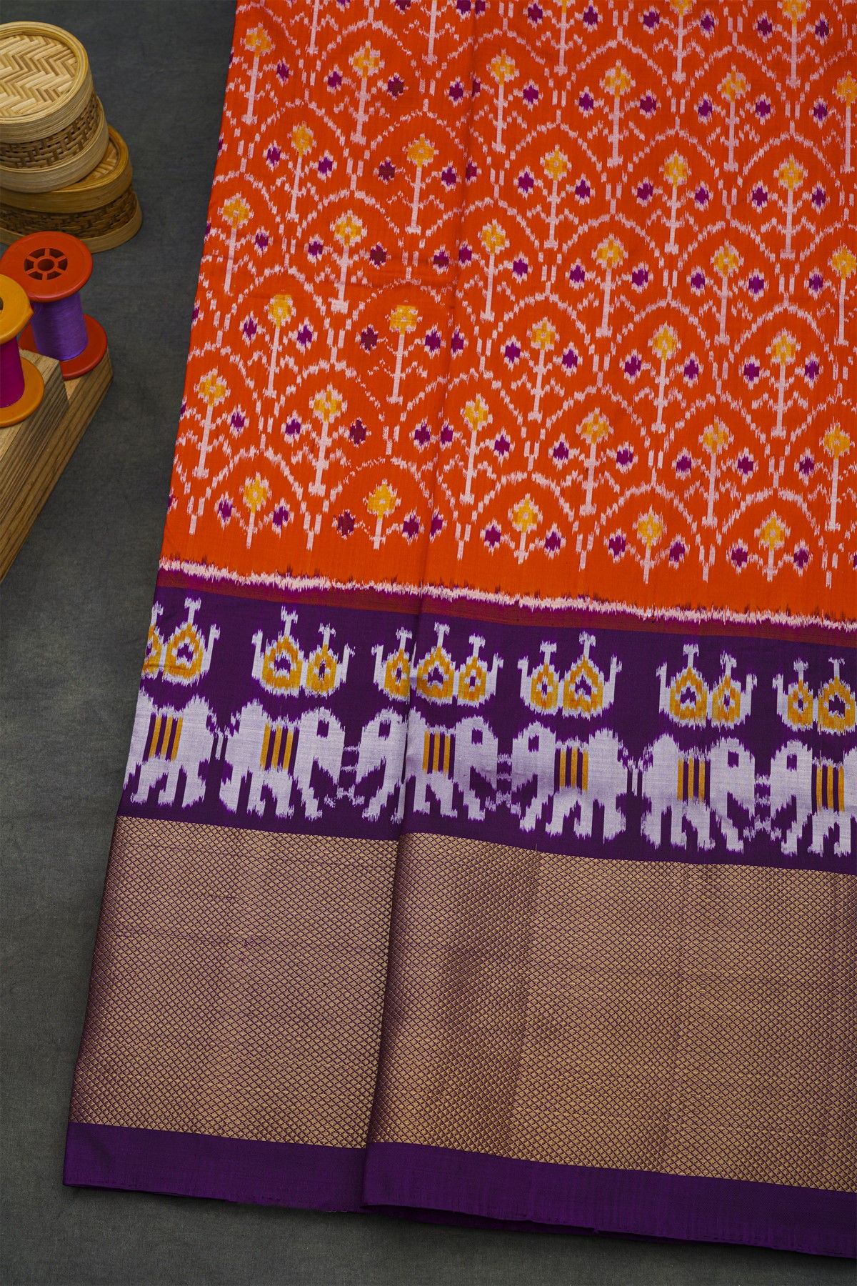 Ikat Silk Orange Saree With Florals And Leaves Body