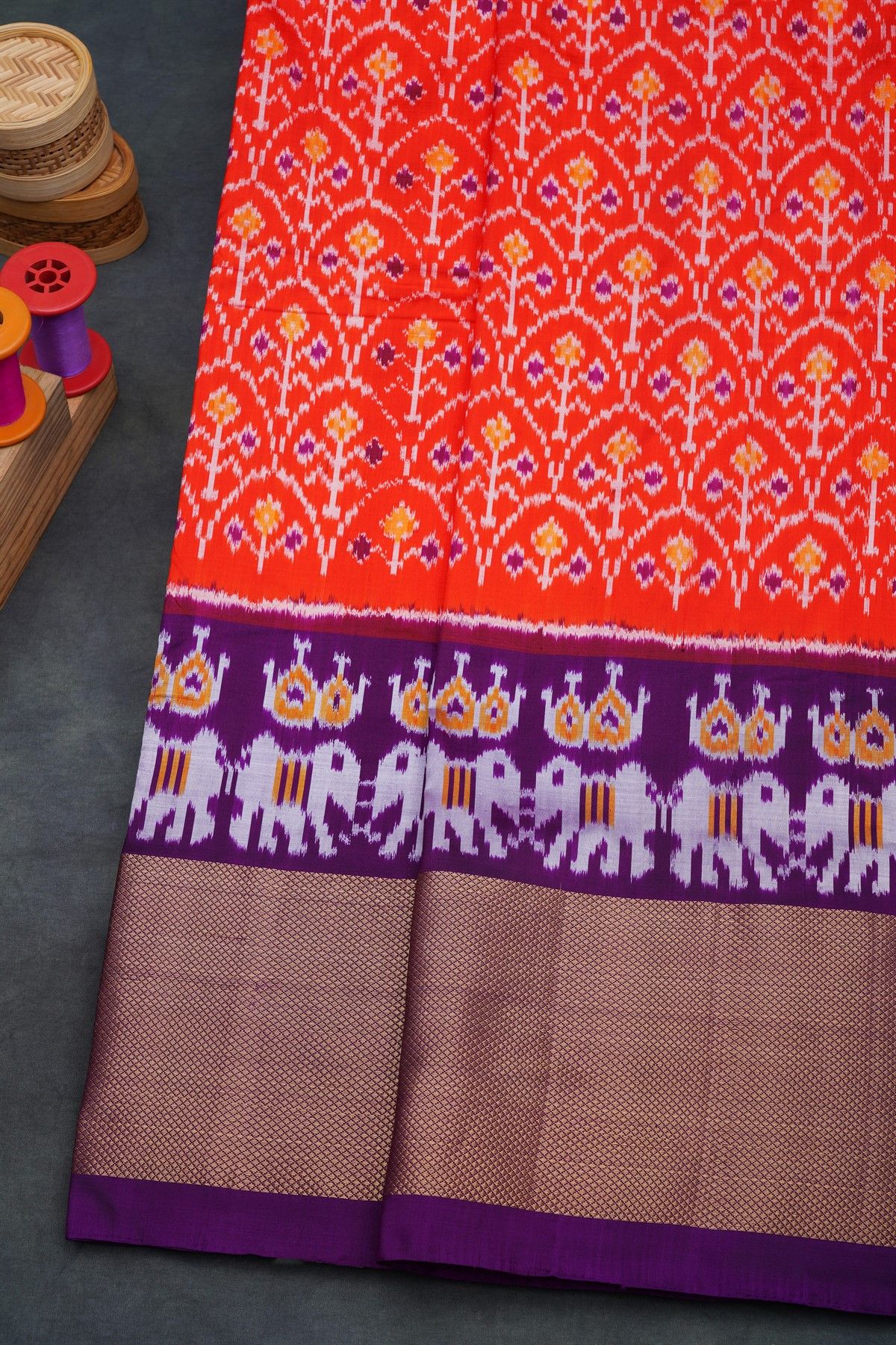 Ikat Silk Orange Saree With Florals And Leaves Body