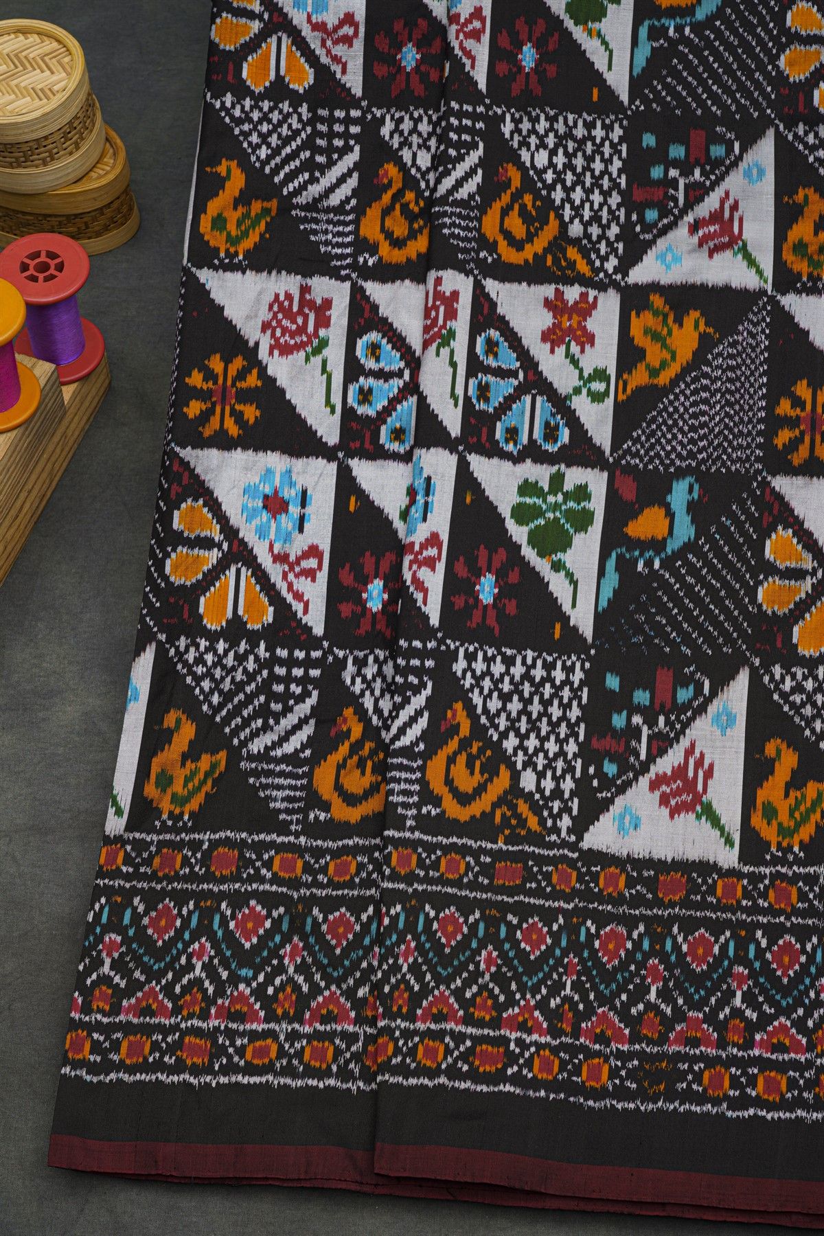 Ikat Silk Black Saree With Florals And Buttis Body