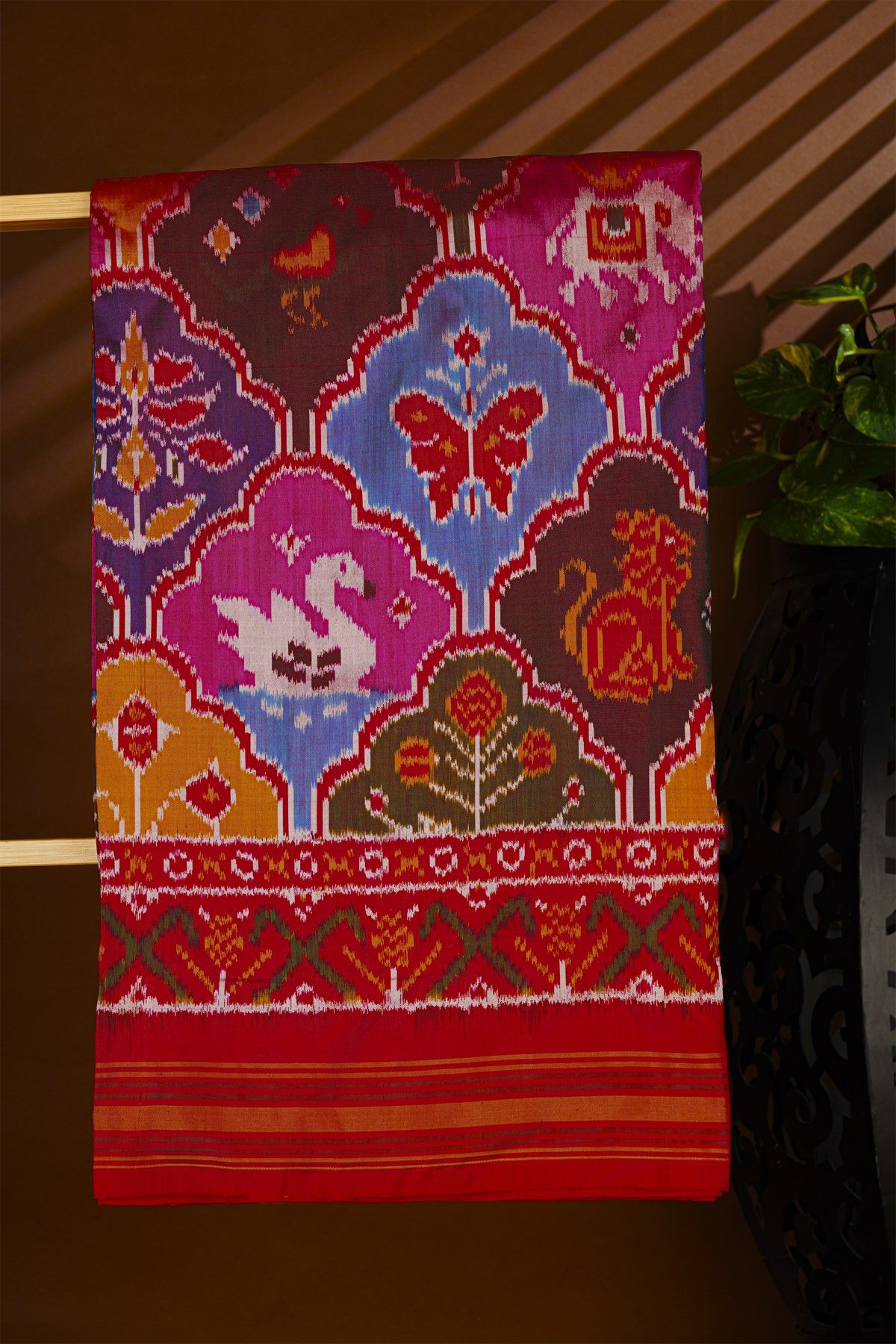 Ikat Silk Multi Colour Saree With Floral Motifs And Red Striped Border