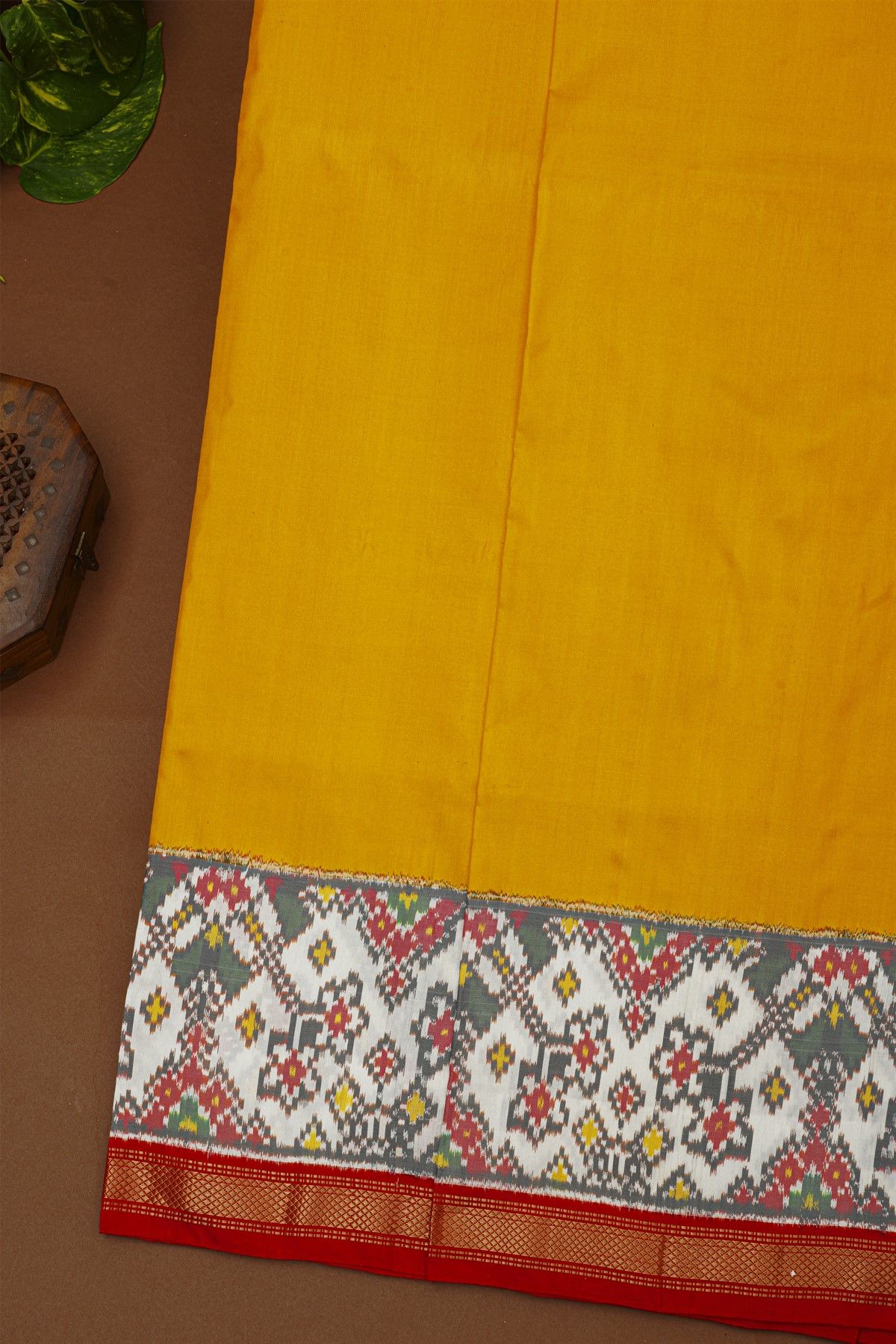 Ikat Silk Yellow Saree With Florals And Leaves With Diamonds Border