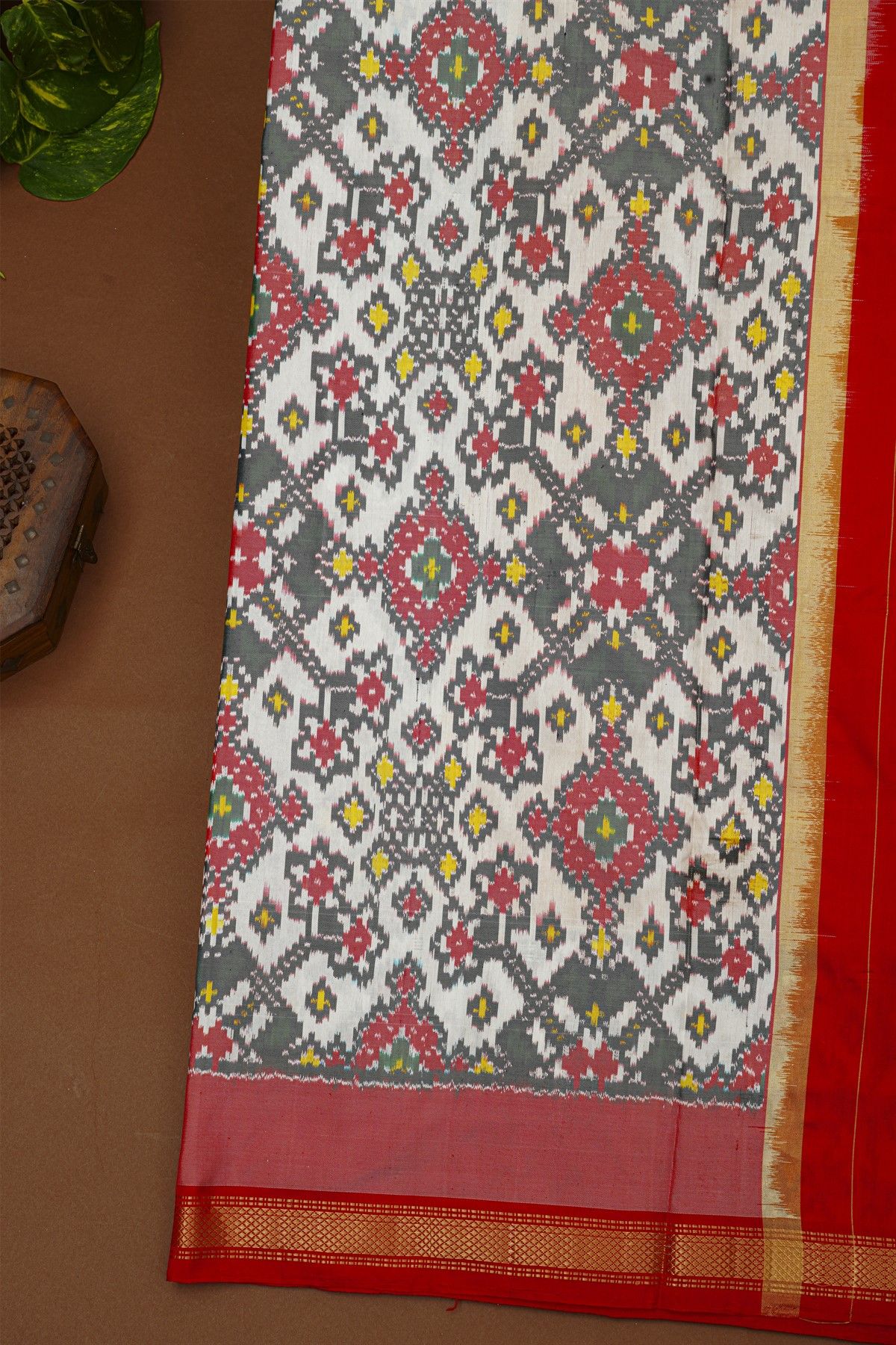 Ikat Silk Yellow Saree With Florals And Leaves With Diamonds Border