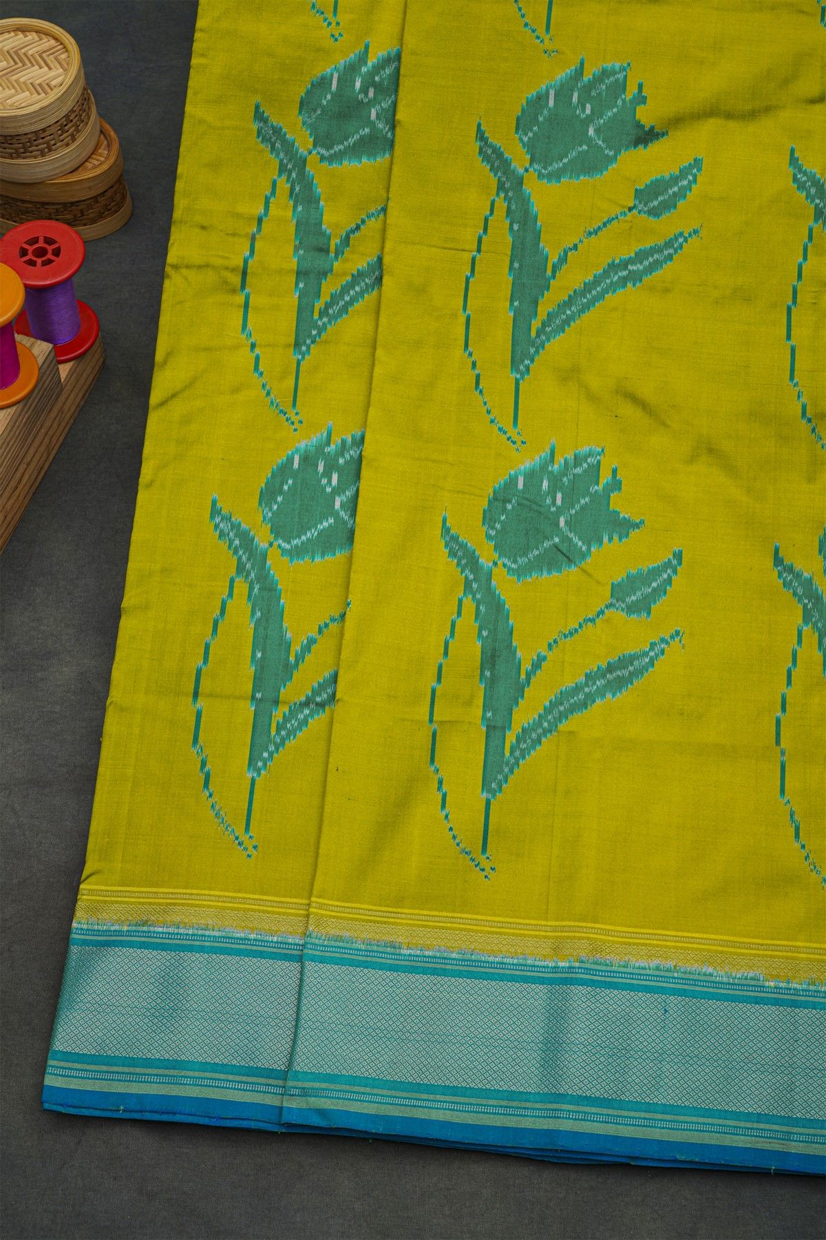 Pochampally Ikat Silk Mehendi Green Saree With Floral Body And Ikat Butti Pallu
