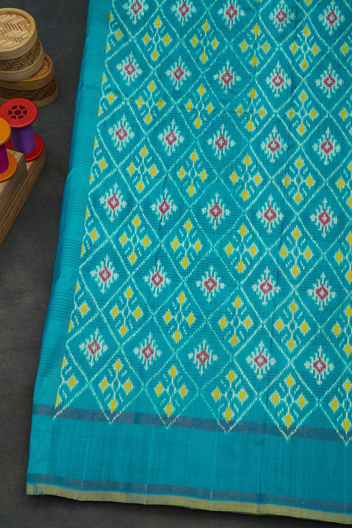 Ikat Silk Turquoise Blue Saree With Checks Body