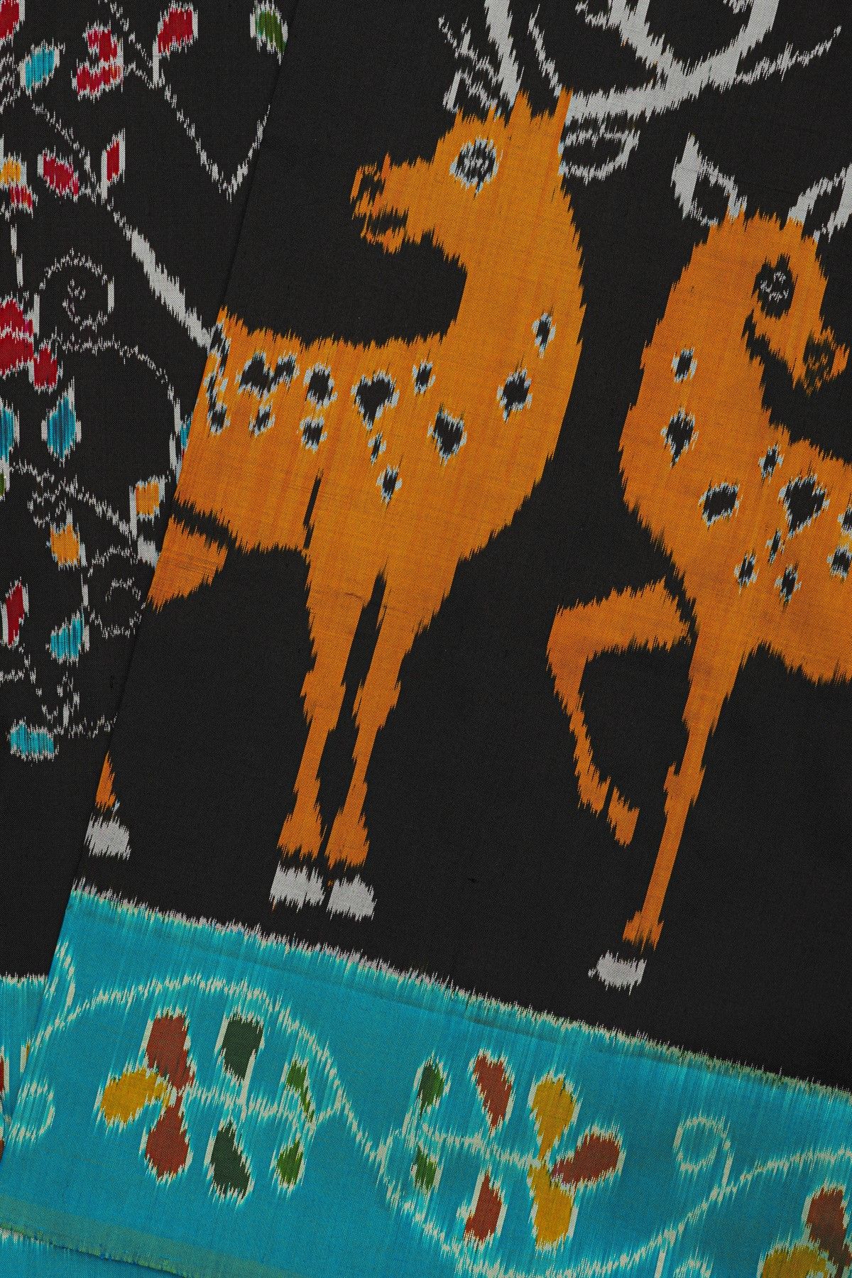 Ikat Silk Black Saree With Florals And Deers In Ikat Design Body